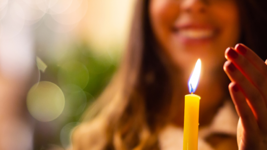 Woman holds candle