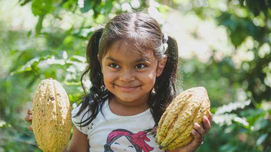 Ariana Blandon 5,  Nicaragua holding cocoa pods.