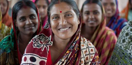 A group of Bangladeshi women smiling at the camera