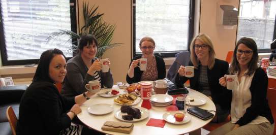 Christian Aid supporters enjoying a coffee at a Coffee for Christian Aid event. 