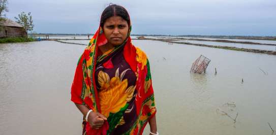 Shikha standing at floods in Bangladesh