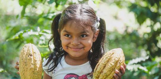 Ariana Blandon 5,  Nicaragua holding cocoa pods.