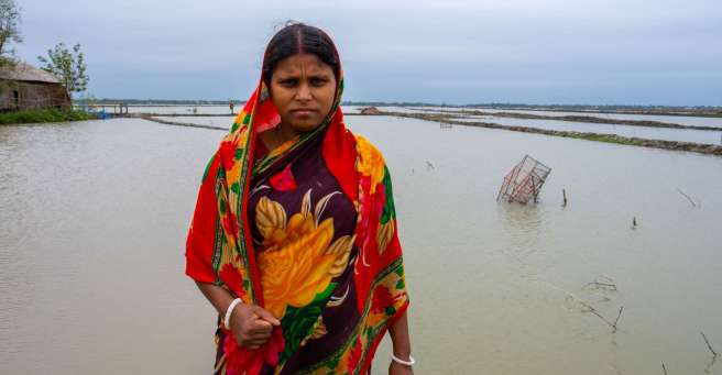 Shikha standing at floods in Bangladesh