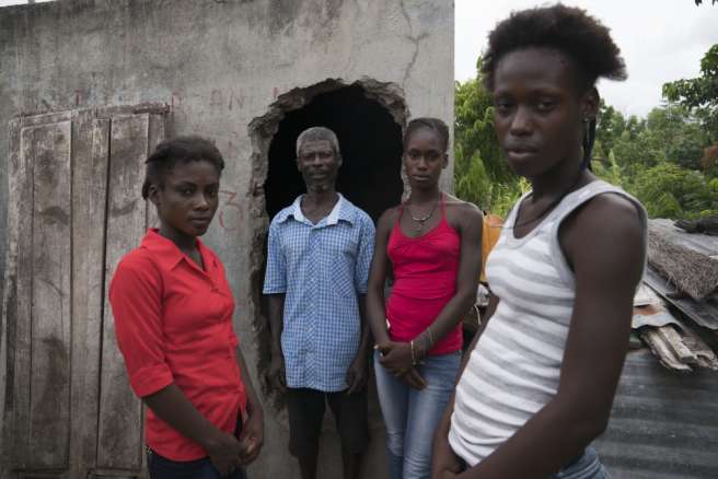 Marcelin and his family in Haiti