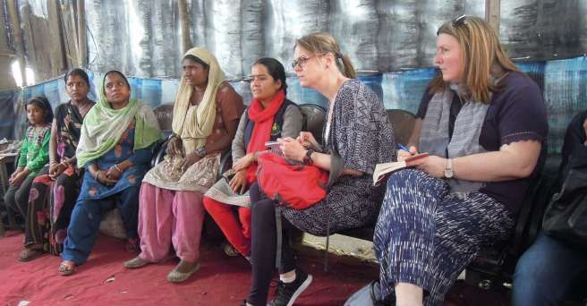 Parents of children attending the Bridge School meet with a group from Christian Aid Ireland in Bhowpur, India, 2017.