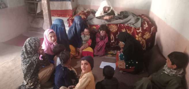  Bibi and her family in their home in Nangahar province, Eastern Afghanistan