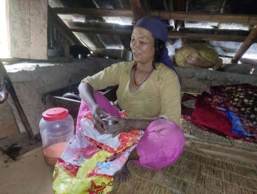 Sani Tamang with the materials she got from Christian Aid through partners