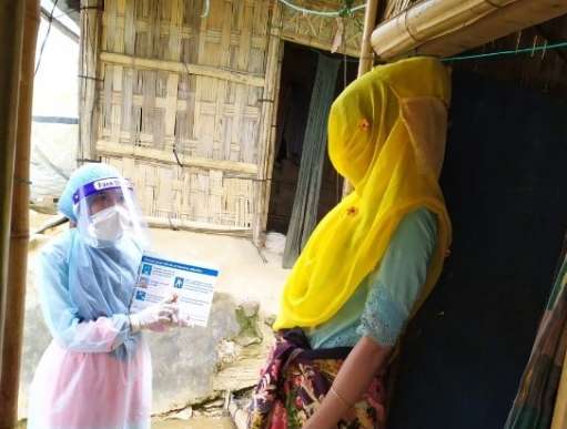 A Community Health Worker from Christian Aid’s local partner goes door-to-door in the Rohingya refugee camps of Cox Bazar’ to raise awareness of keeping safe from coronavirus. 