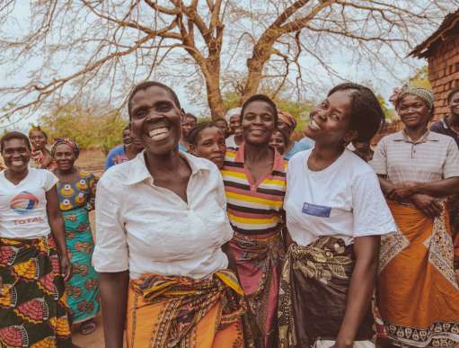 Margaret Nsona and her friends dancing in Chikwawa, Malawi. Margaret was supported by Christian Aid's Cyclone Idai response.
