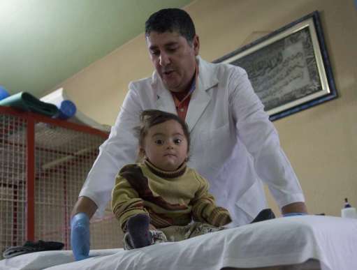 Two year old Zainab al-Zoori receives care from Christian Aid partner LPHU in Beqaa Valley, Lebanon