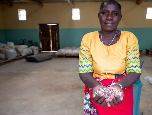 Woman holding crops in Malawi
