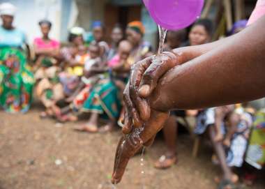 A hand-washing clinic run by Judith Lassie in the village of Sawula, Sierra Leone.