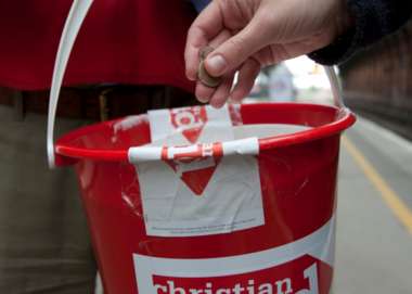 Red collecting bucket with Christian Aid logo