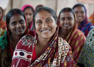 A group of Bangladeshi women smiling at the camera