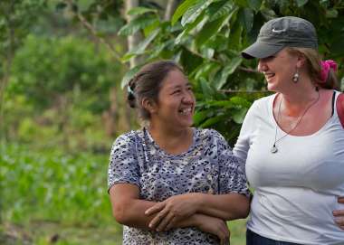 Emma Donlon speaks with local woman, Esther, in the Amazon rainforest