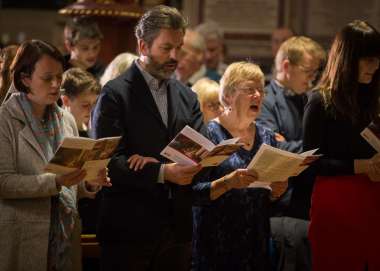 Christian Aid congregation singing at church service
