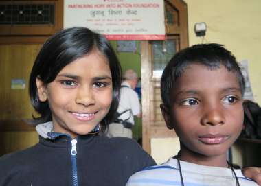 Charisma, 10, and her friend at the Bridge school run by Christian Aid partner, Phia, in Bhowpur, India.