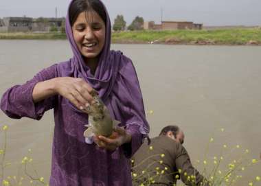 Girl holding fish