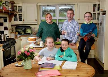 Susie Hamilton with her family in their home in Saintfield, County Down